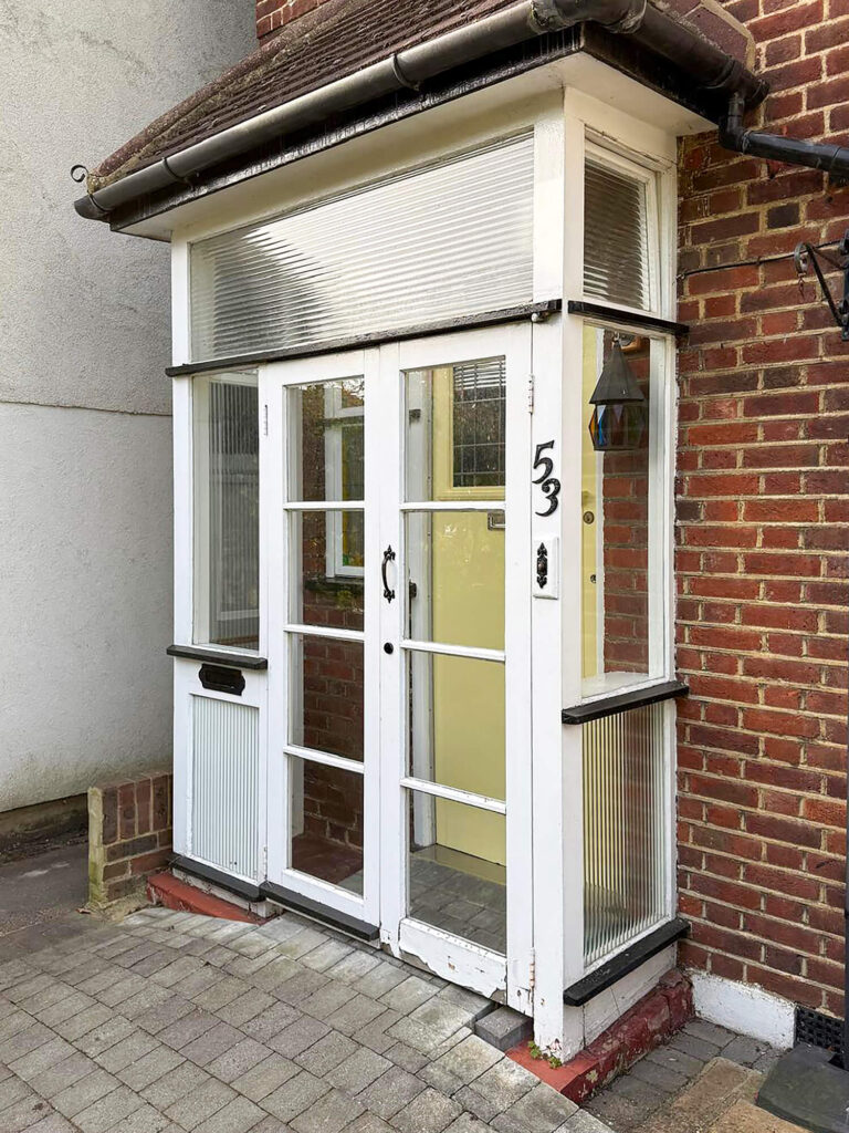 Existing timber porch is single glazed and draughty