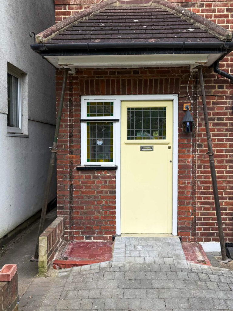 Existing porch removed with roof safely supported on acro-props